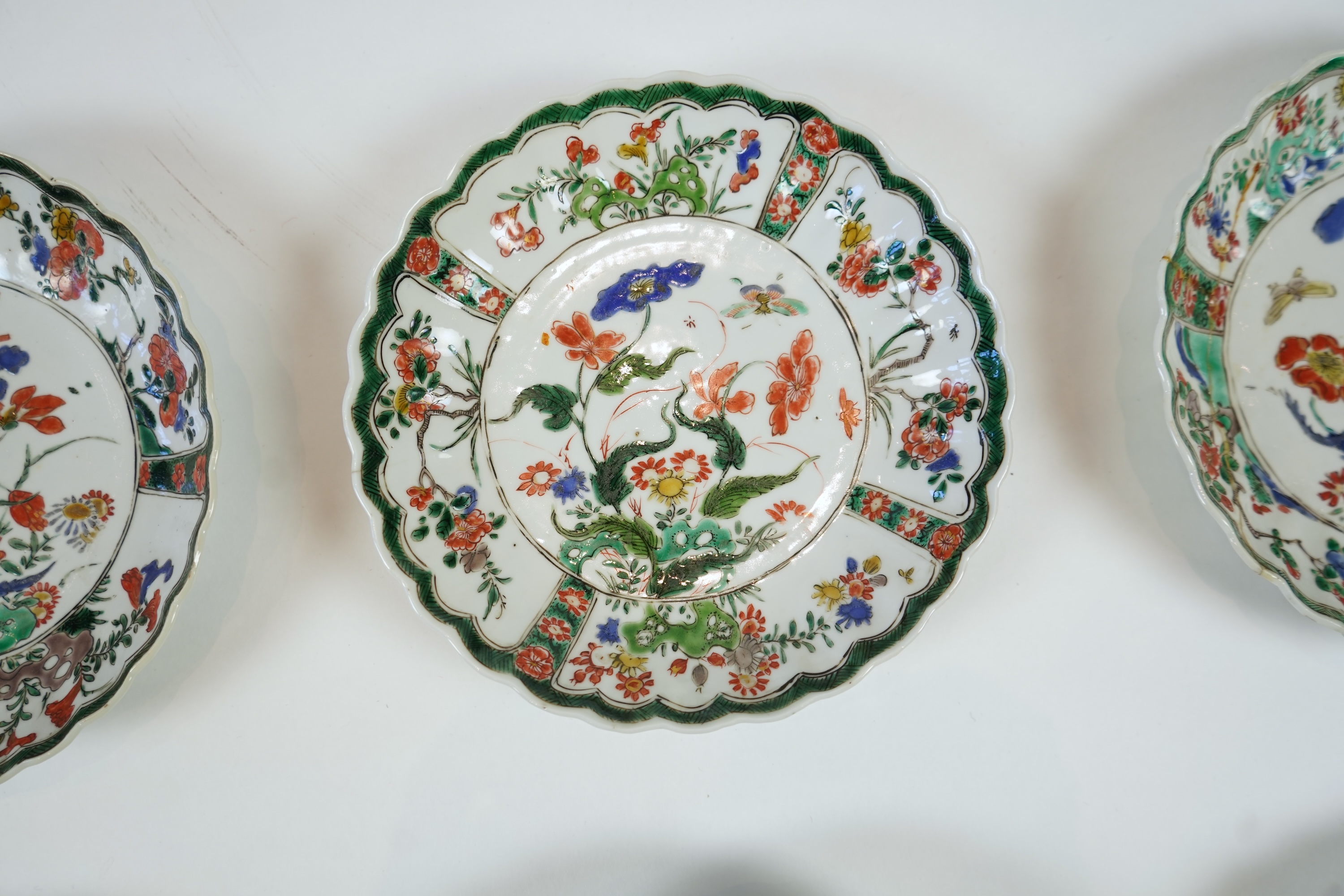 A set of six Chinese famille verte petal lobed saucer dishes, Kangxi period